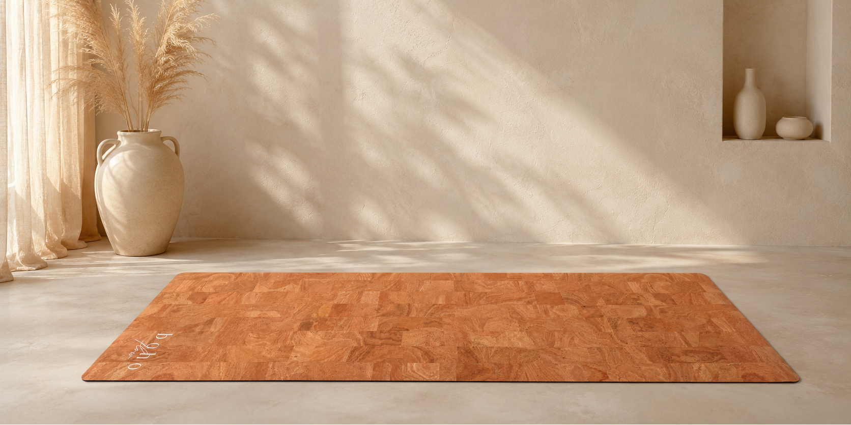A side view of the Boho Flow Luxe Leather cork yoga mat laid out flat with the cork surface nicely visible in a minimalist boho setting,