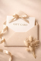Gift card in a beige envelope with a bow on a beige background