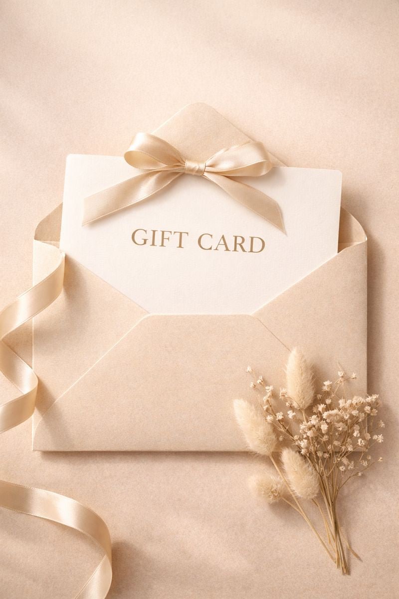 Gift card in a beige envelope with a bow on a beige background