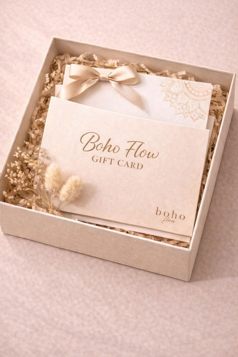 Boho Flow gift card in a decorative box with dried flowers on a light pink background