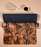 Rolled Up Boho coffee and cork yoga mat with  'boho flow' text on a beige background with a cup of coffee and dried plant.