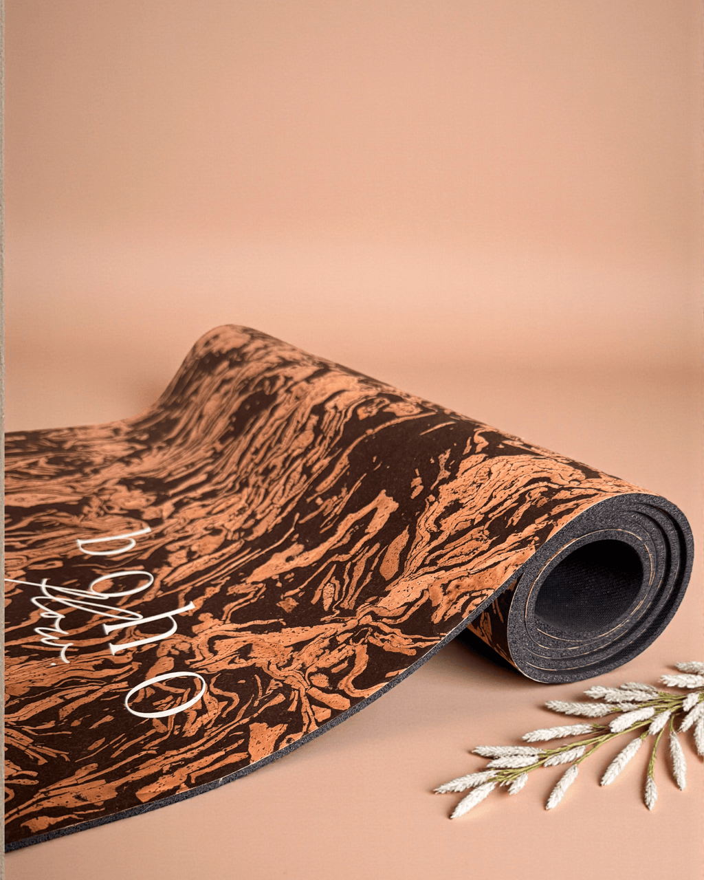 Coffee and Cork yoga mat on a beige background