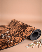 Coffee and Cork yoga mat on a beige background