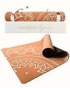 Product shot of the Boho Flow Mandala Design Cork Yoga Mat at an angle, also with the packaging box and rolled mat in the background, on a transparent background.