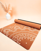 The Boho Flow Print Edition Cork Yoga Mat with white Mandala design, offset to the bottom right corner, photographed at an angled shot to showcase the design on a neutral background.